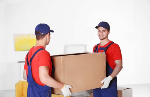 Moving van and packed boxes outside a Chelsea property