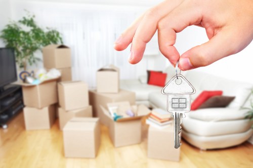 Furniture pick-up service removing a sofa in Chelsea