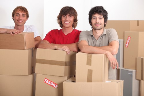 Mover wearing PPE while handling furniture