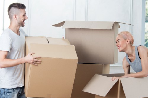 Local movers transporting furniture through Chelsea streets